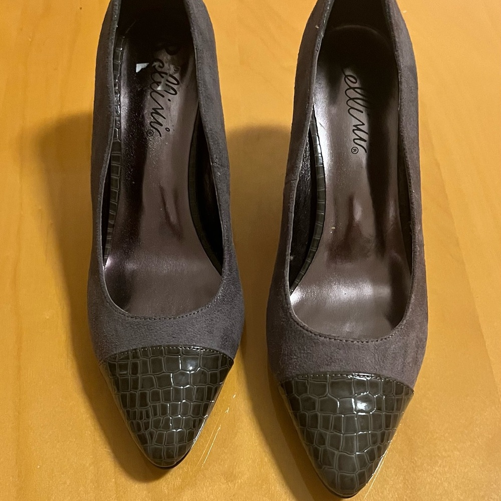 Three inch gray pumps.